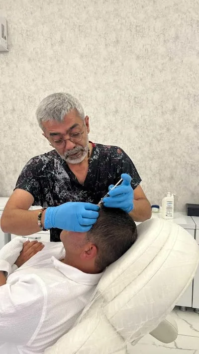 Dr Erhan Çömü